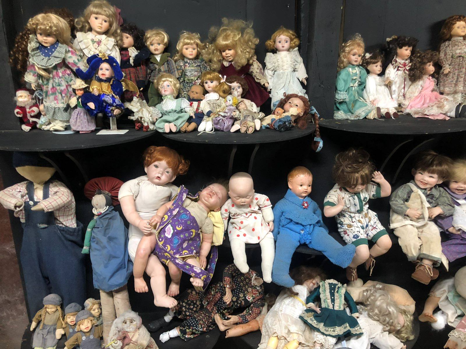 Shelves of dolls in the All Sorts room