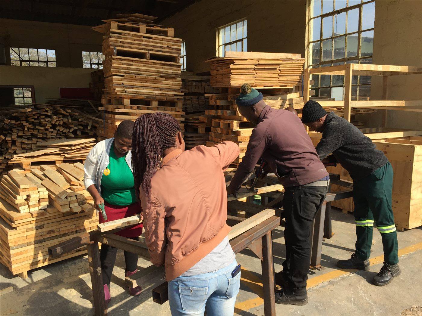 Community members choosing timber in the yard