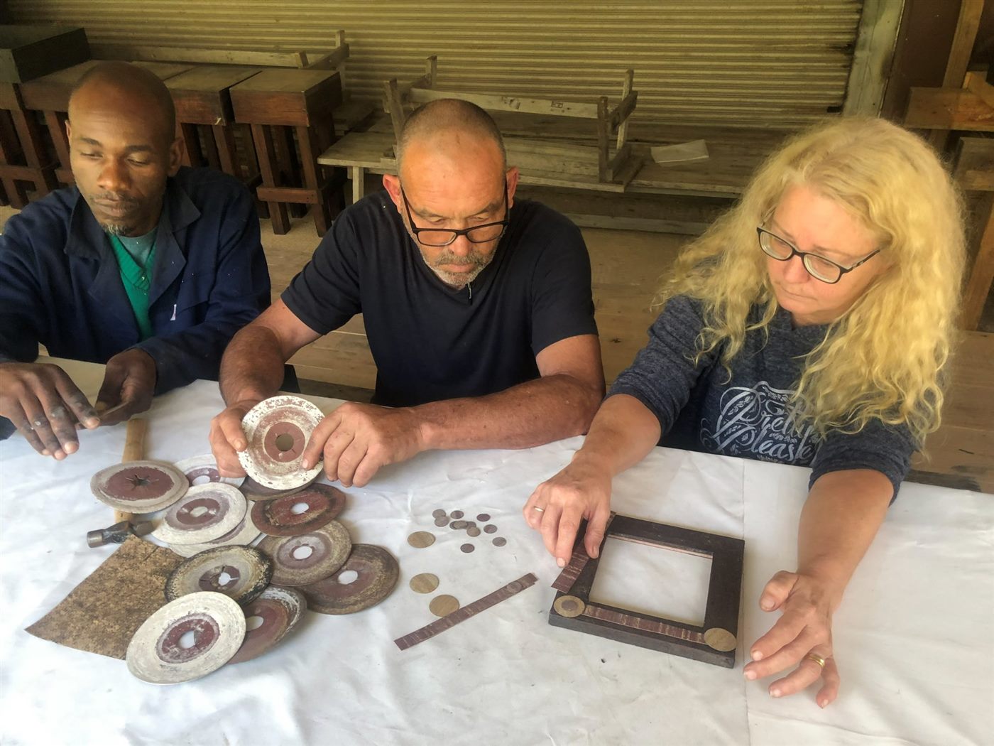 People making something together at the artisan craft table