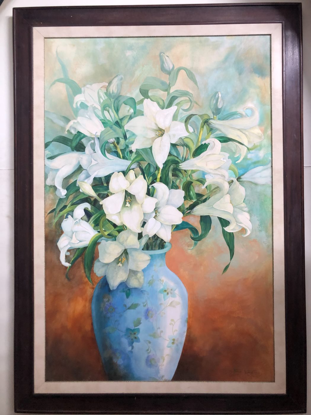 A framed painting of white lilies