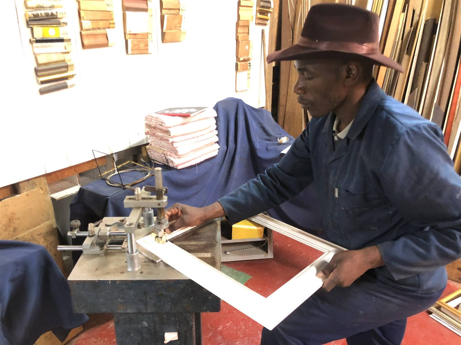 A framer joining a white frame at the machine