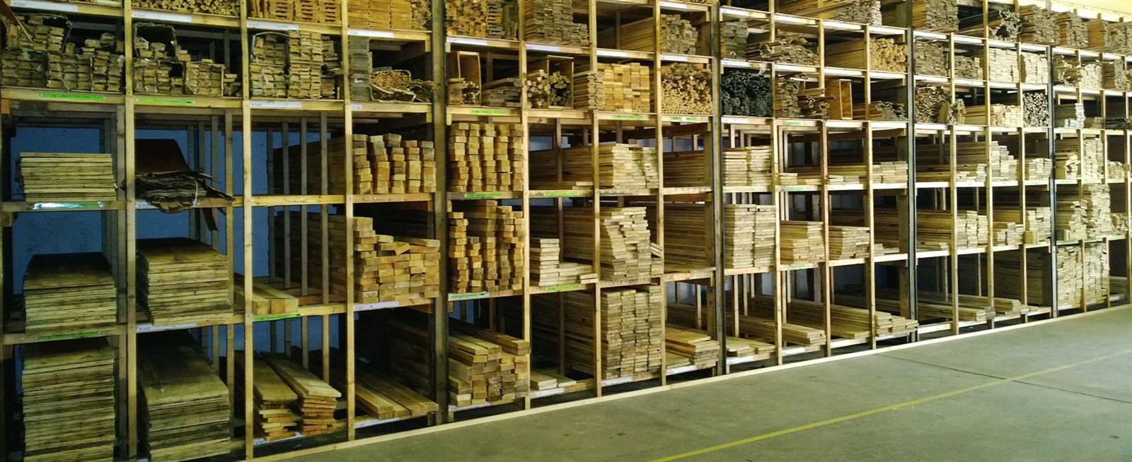 Long shelves stacked full of reclaimed timber, as far as the eye can see