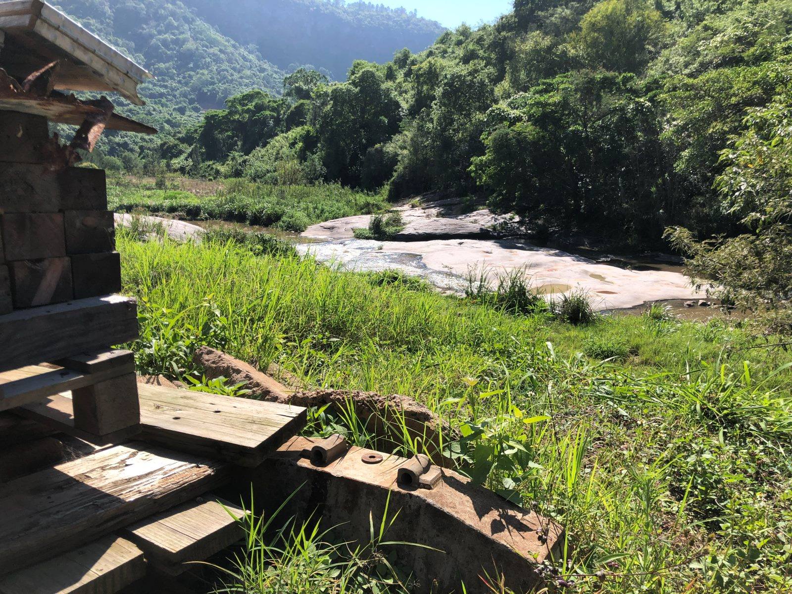 The river running over the rocks in the Shongweni valley, the mountain behind